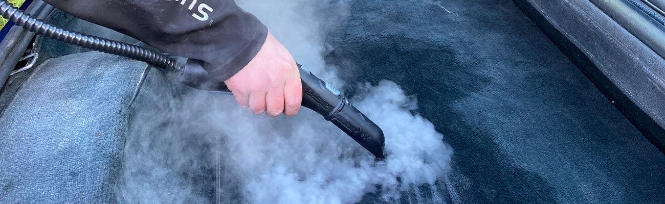 Cleaning air vents with brush and hoover