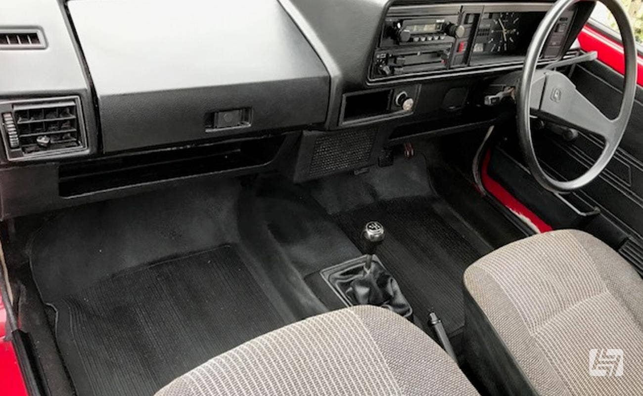 Original interior of right hand drive VW Caddy Mk1 with manual transmission 