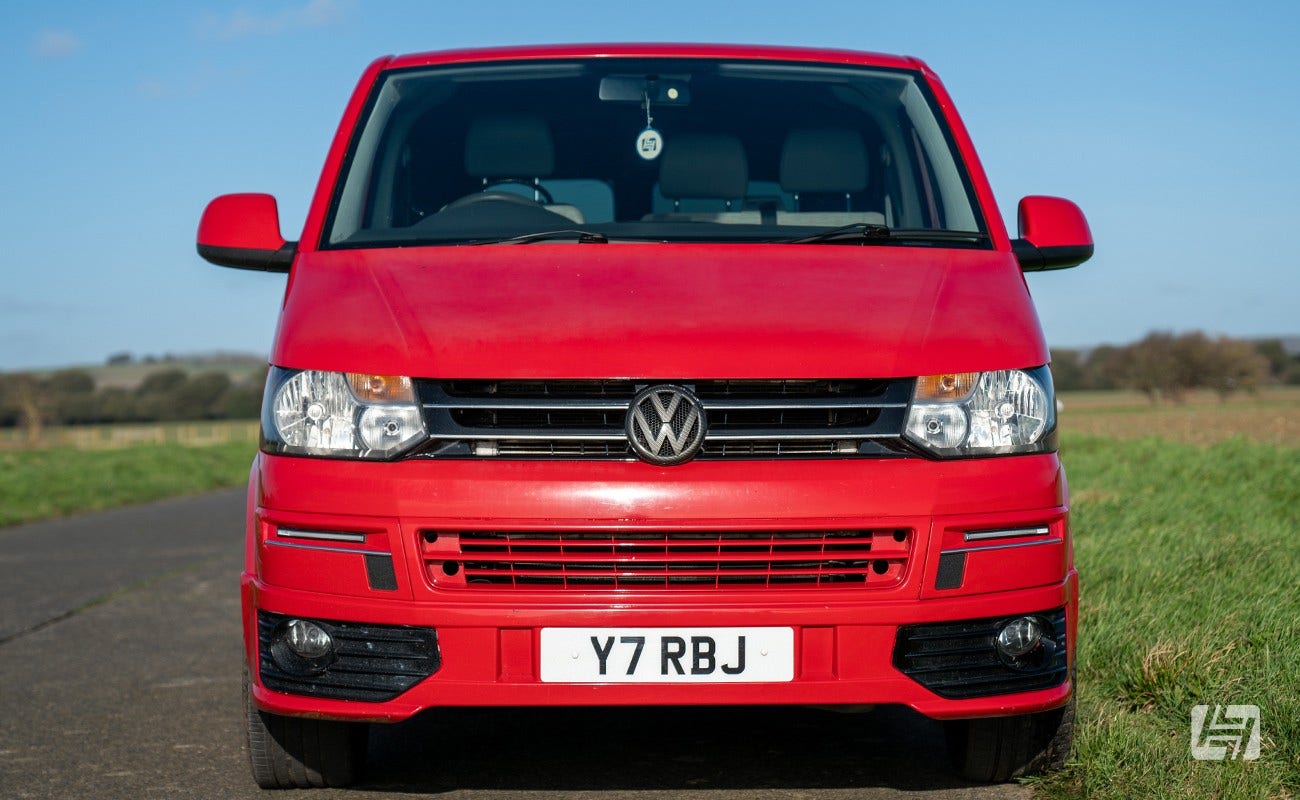 Red Volkswagen T5 with T5.1 front end conversion fitted. 