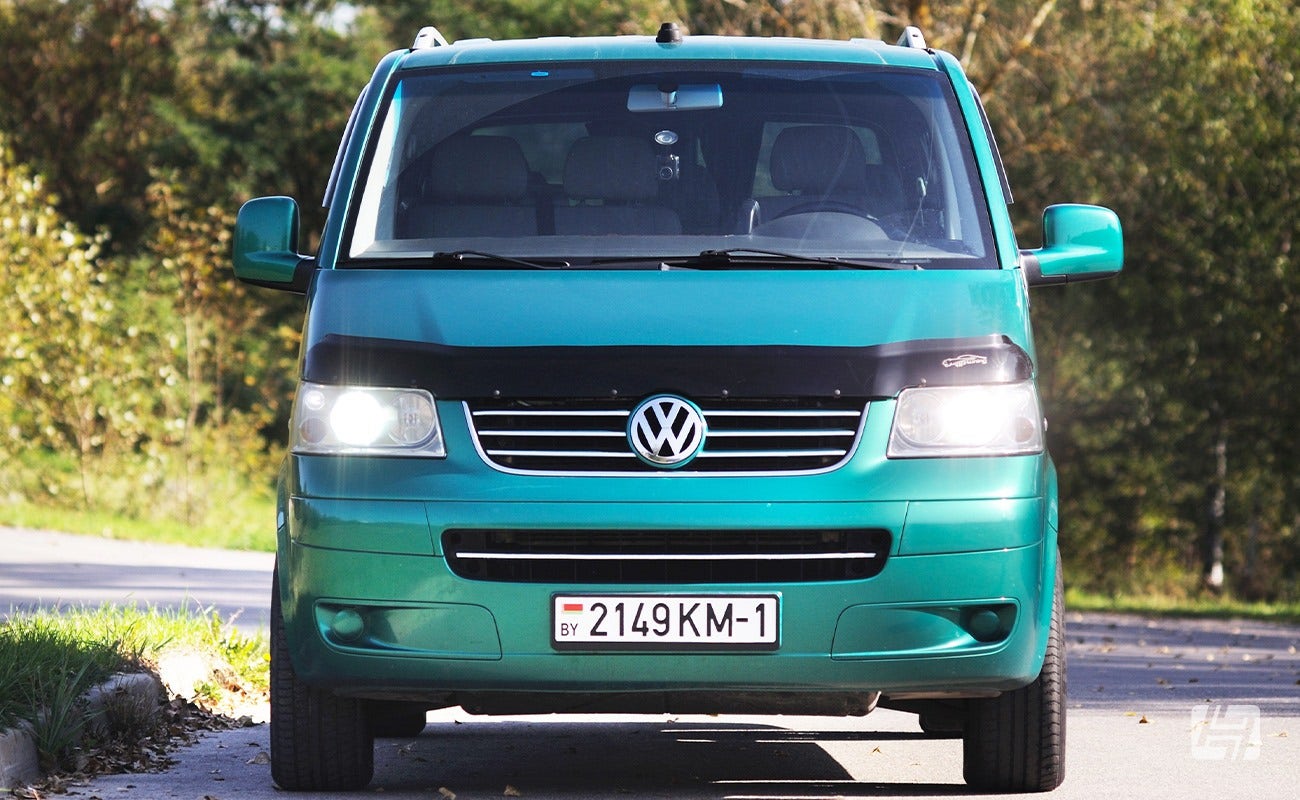 Green Volkswagen T5 front end photo with bonnet protector