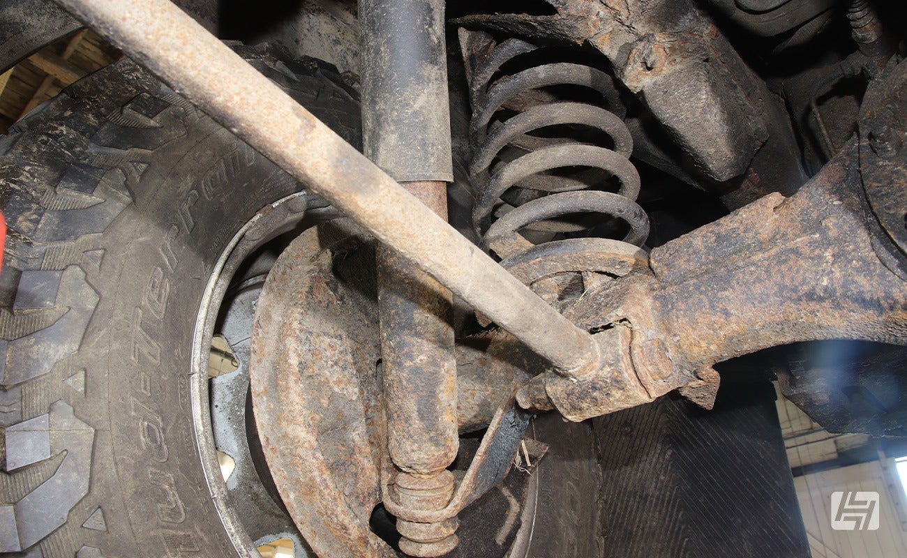 rusty Land Rover Defender shock absorbers fitted