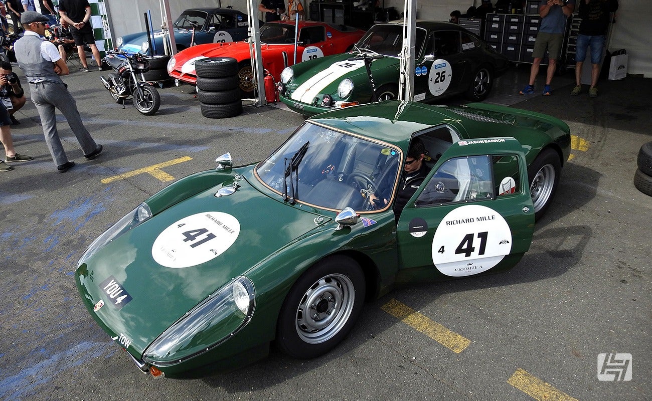 Green Porsche 904 Carrera race car in paddock at Le Mans Classic 2023