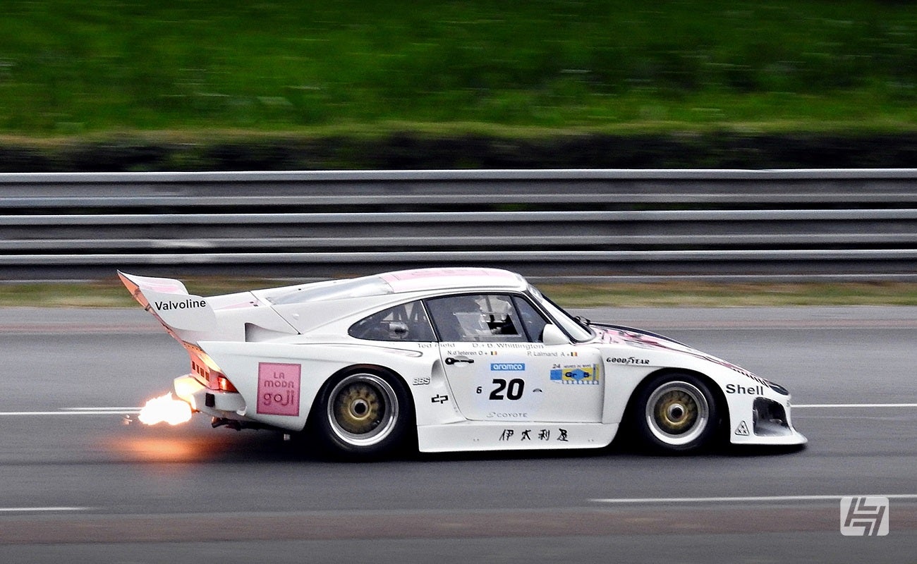 White Porsche 935 race car with flaming exhaust at Classic Le Mans 2023
