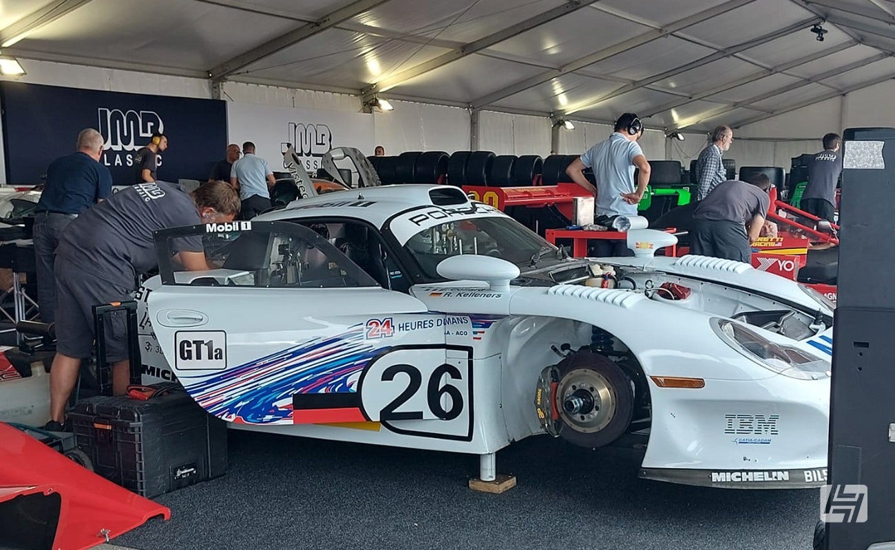 mechanics working on Porsche GT1 race car at Le Mans Classic 2023