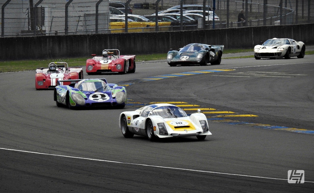 Procession of classic endurance race cars at Le Mans Classic 2023