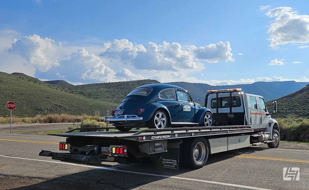 Blue VW Beetle and Recovery Truck