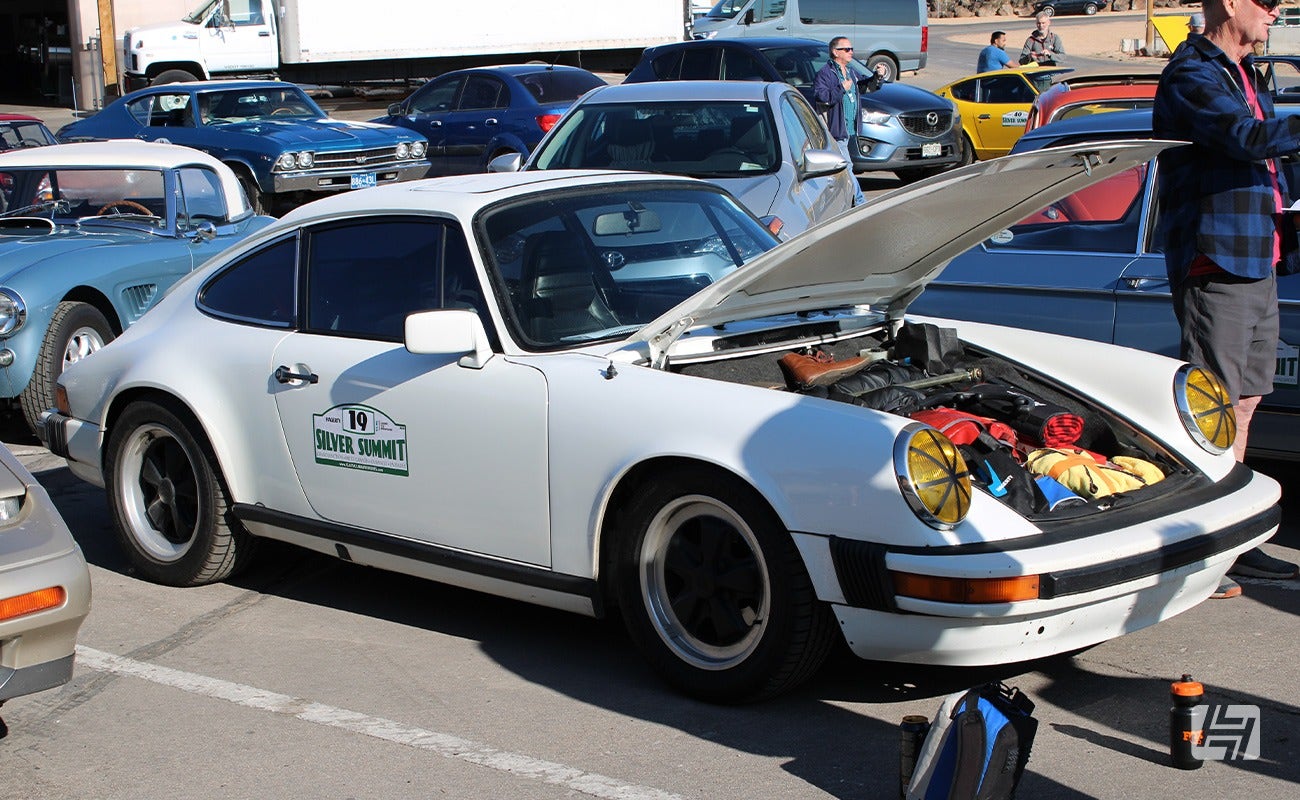 White Porsche 911 SC at parc ferme in the 2023 Silver Summit Rally