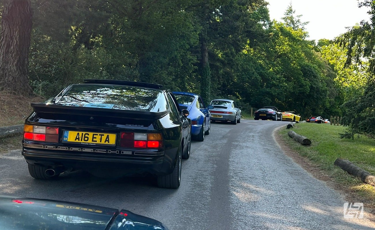 Porsches driving into Simply Porsche 2023