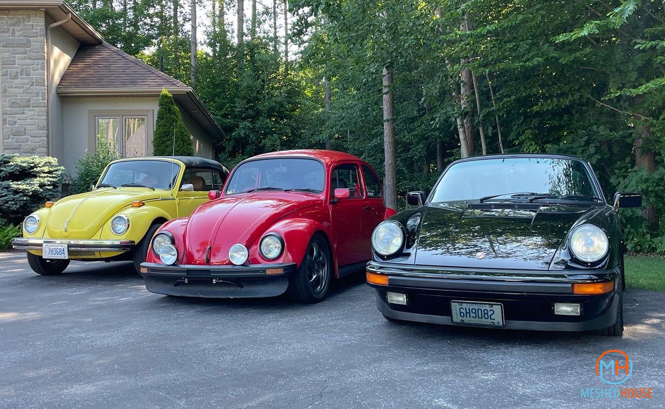 Dave Hord's red German looker with his father's yellow Beetle and black 911