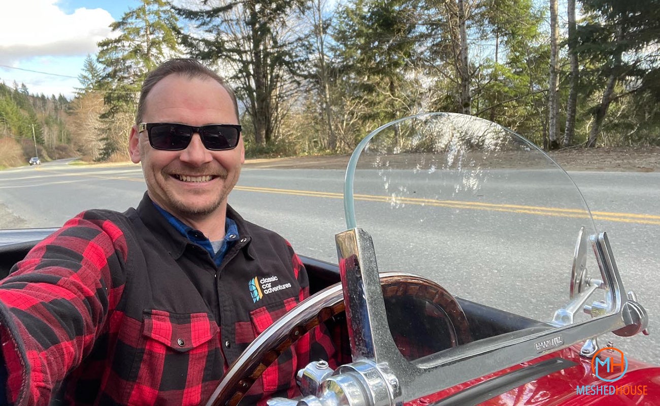 Dave Hord from Classic Car Adventures, behind the wheel of a classic MG Roadster