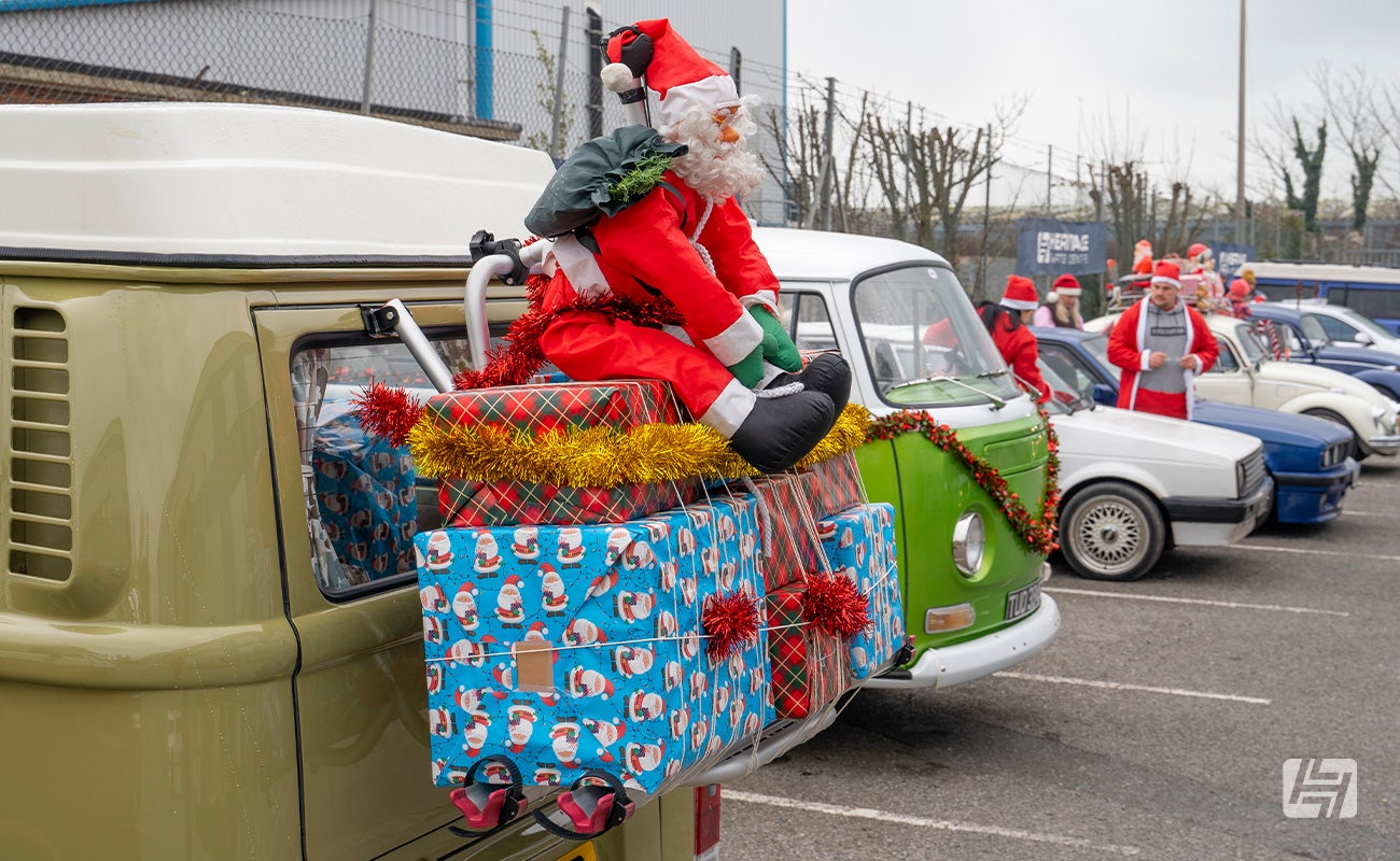 VW Type 2 Bay with Santa and presents mounted on rear bike rack 