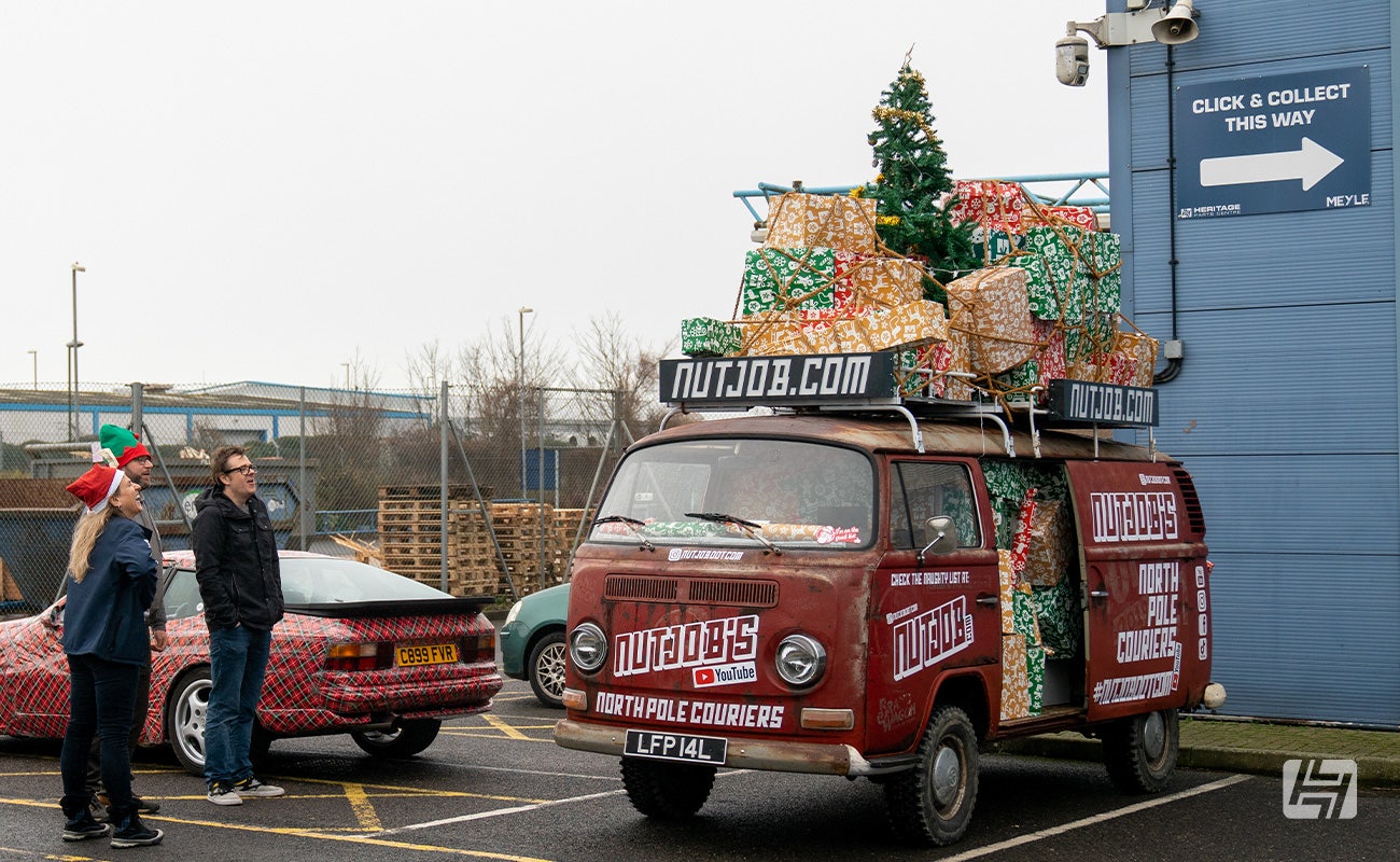 Decorating cars for Christmas VW Type 2 with presents inside and on roof rack