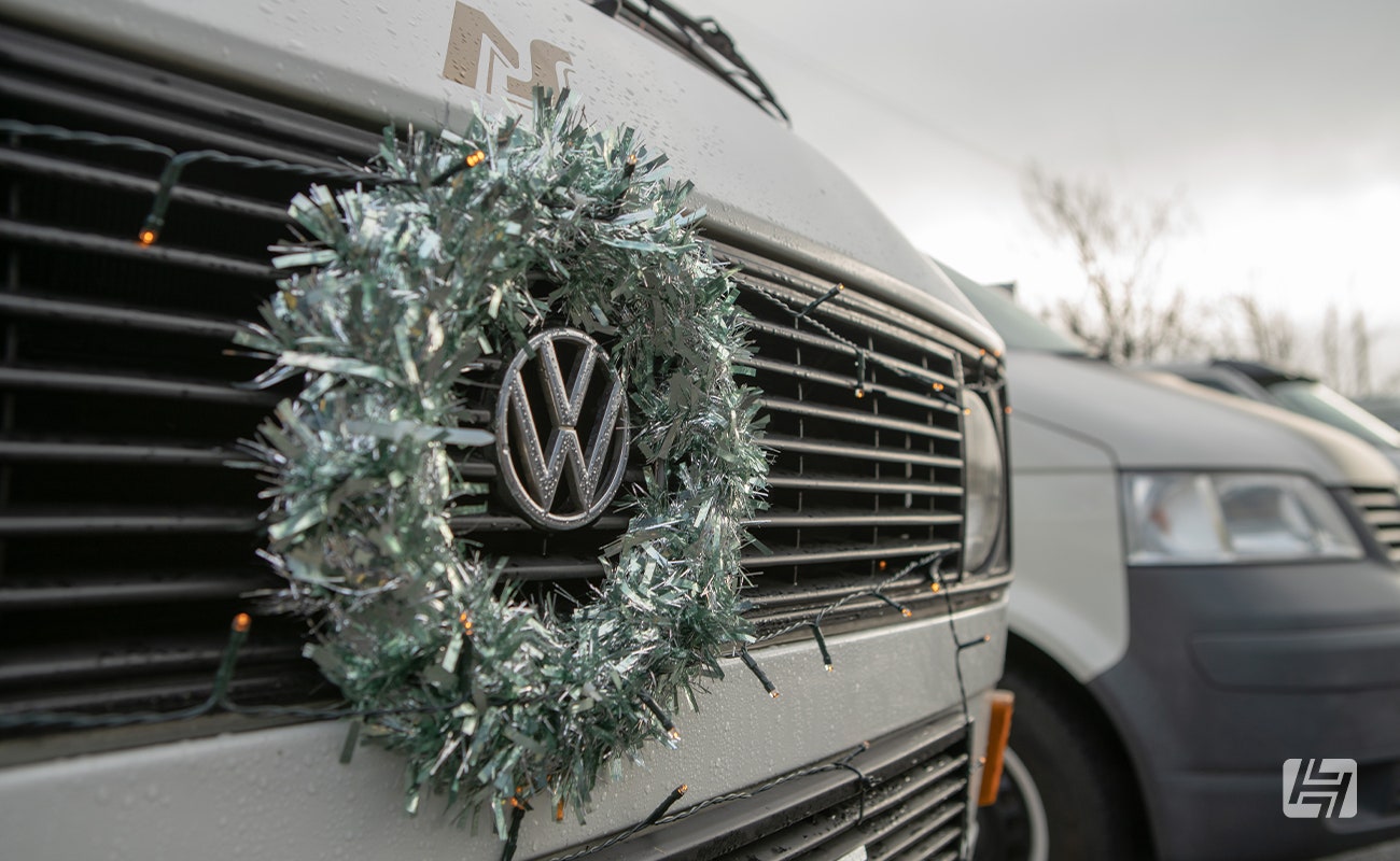 White VW T25 with Christmas wreath on the front grille