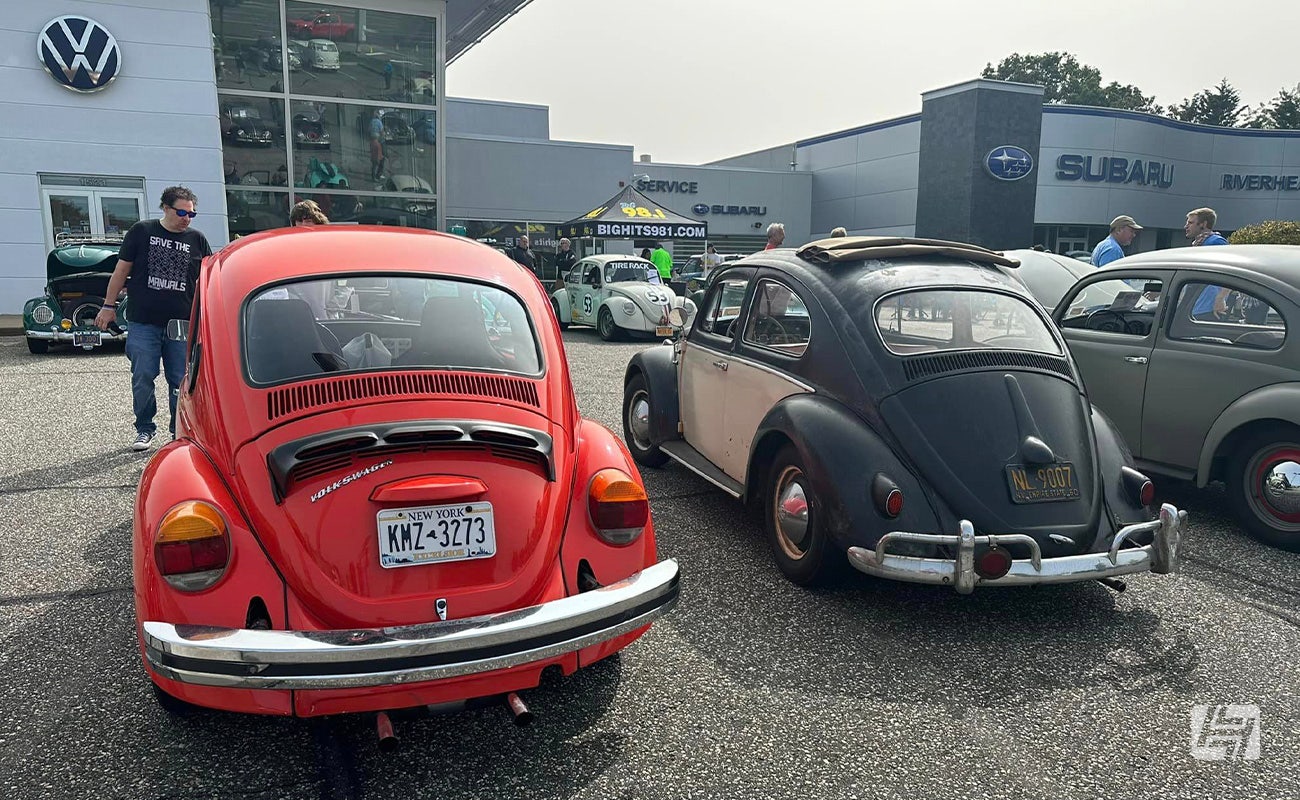 Long Island VW Club Show carpark with red and black VW Beetle