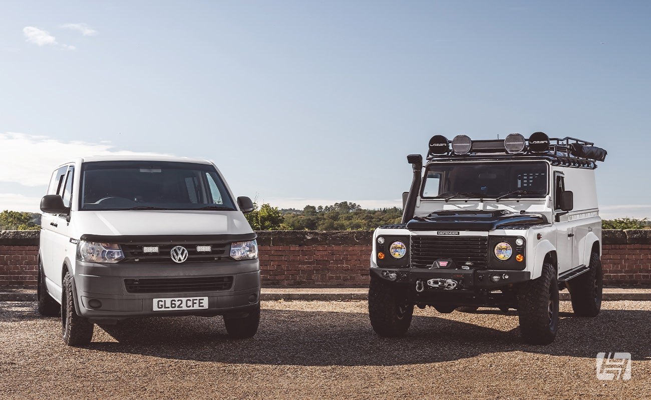 White Swamper style VW T6 and white Land Rover Defender