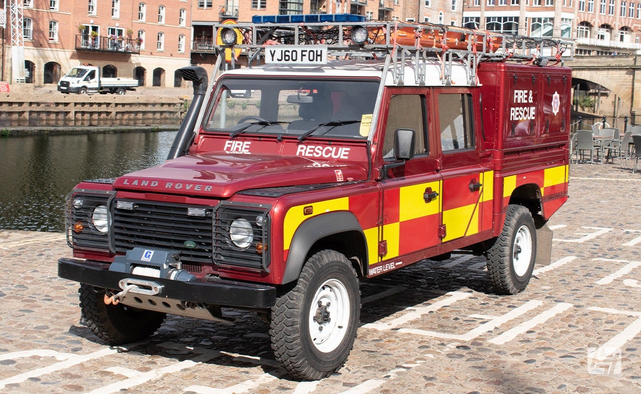 Land Rover Fire wagon parked by canal 