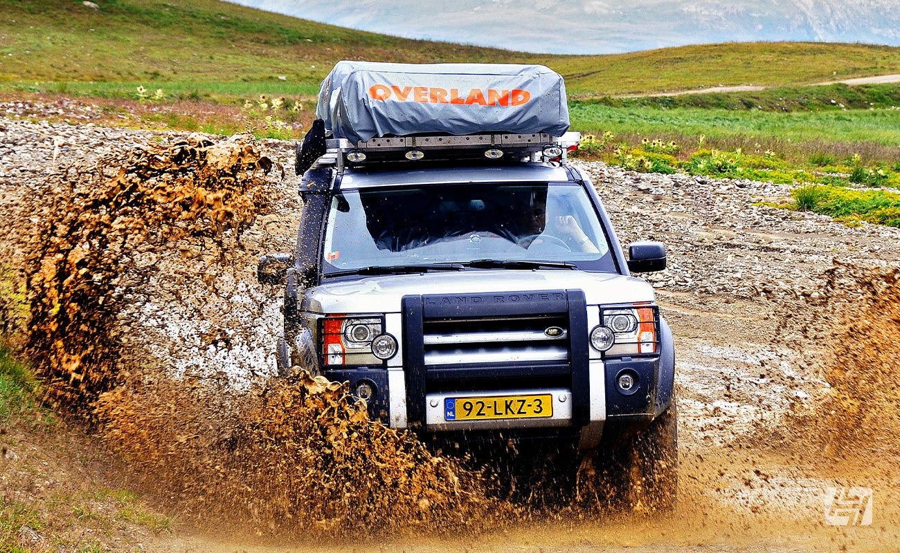 Land Rover Discovery in muddy water splash