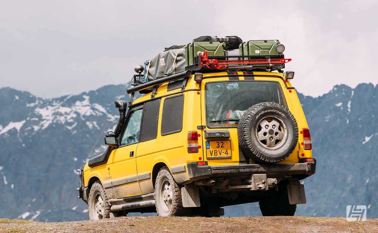 Yellow Land Rover Discovery 3 door