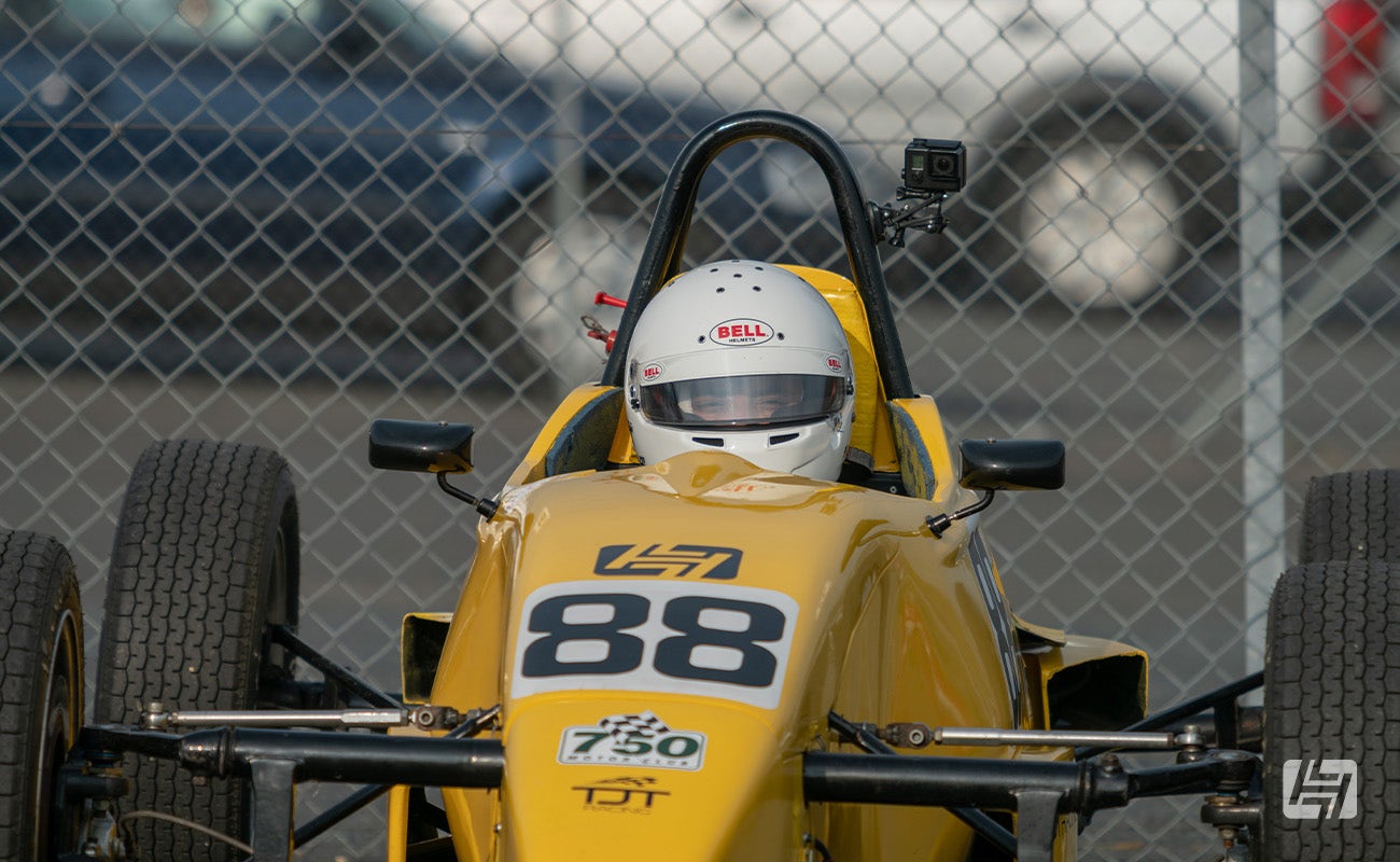 Driver sat in a Formula Vee race car
