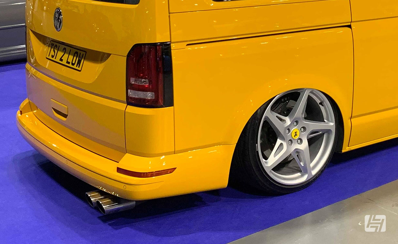 Yellow modified VW T5 with performance exhaust and Ferrari wheels