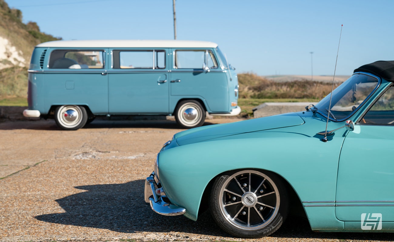 Blue VW Type 2 and blue VW Karmann Ghia Cabriolet
