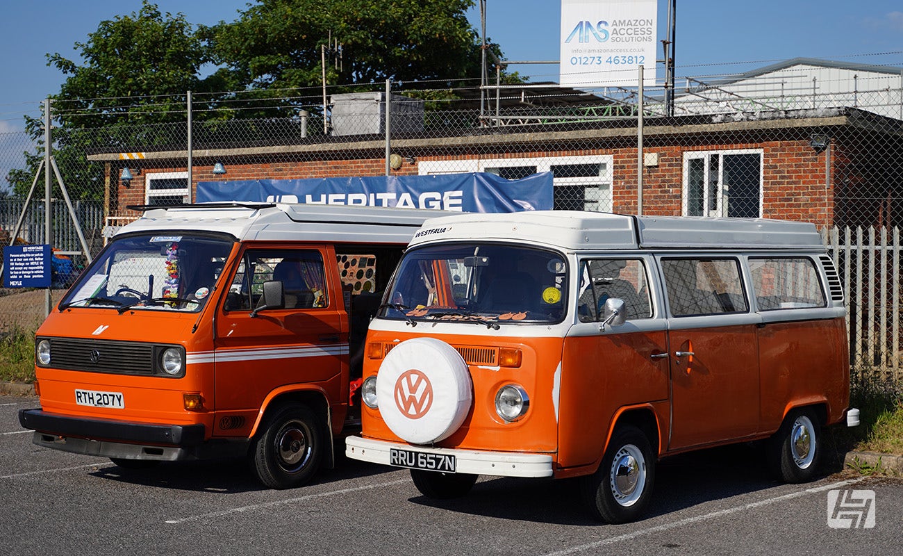 Orange VW Type 25 and orange VW Type 2 Bay at Heretics at Heritage Parts Centre in June 2024