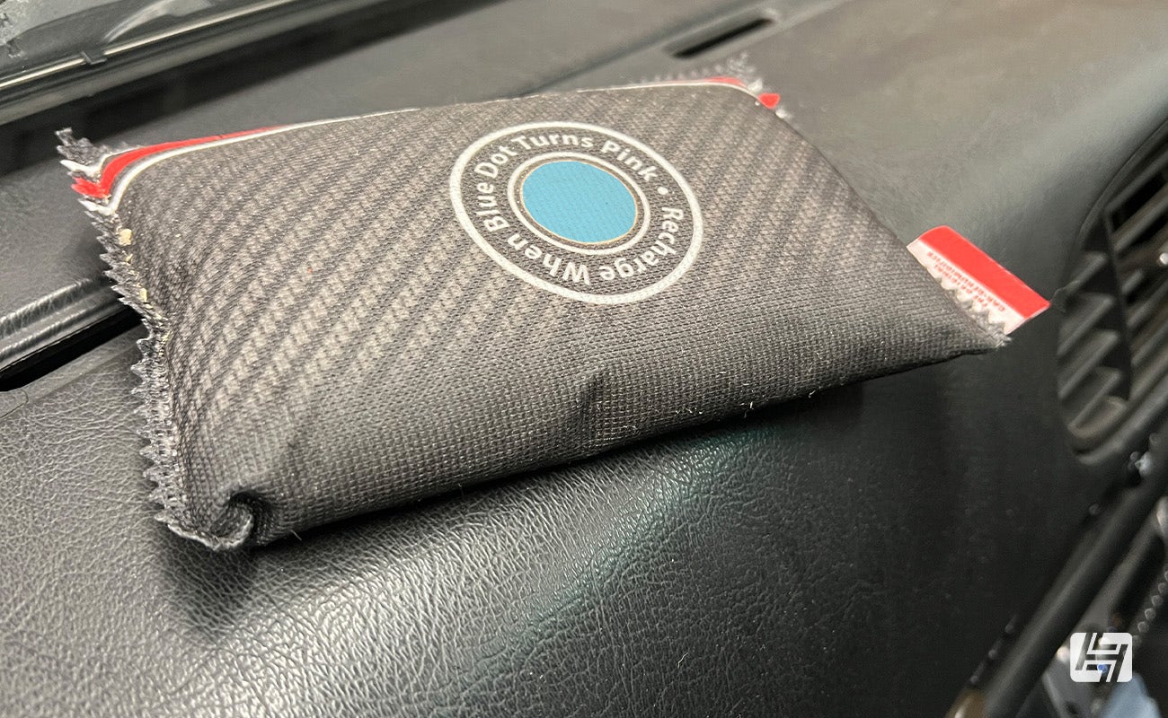 dehumidifier bag on classic car dashboard