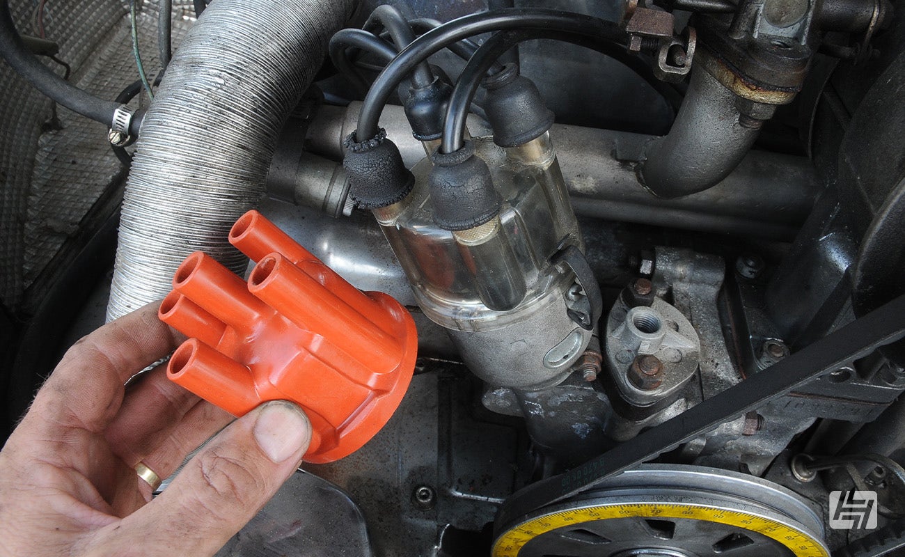 Comparing a new distributor cap with an old one on an aircooled VW engine