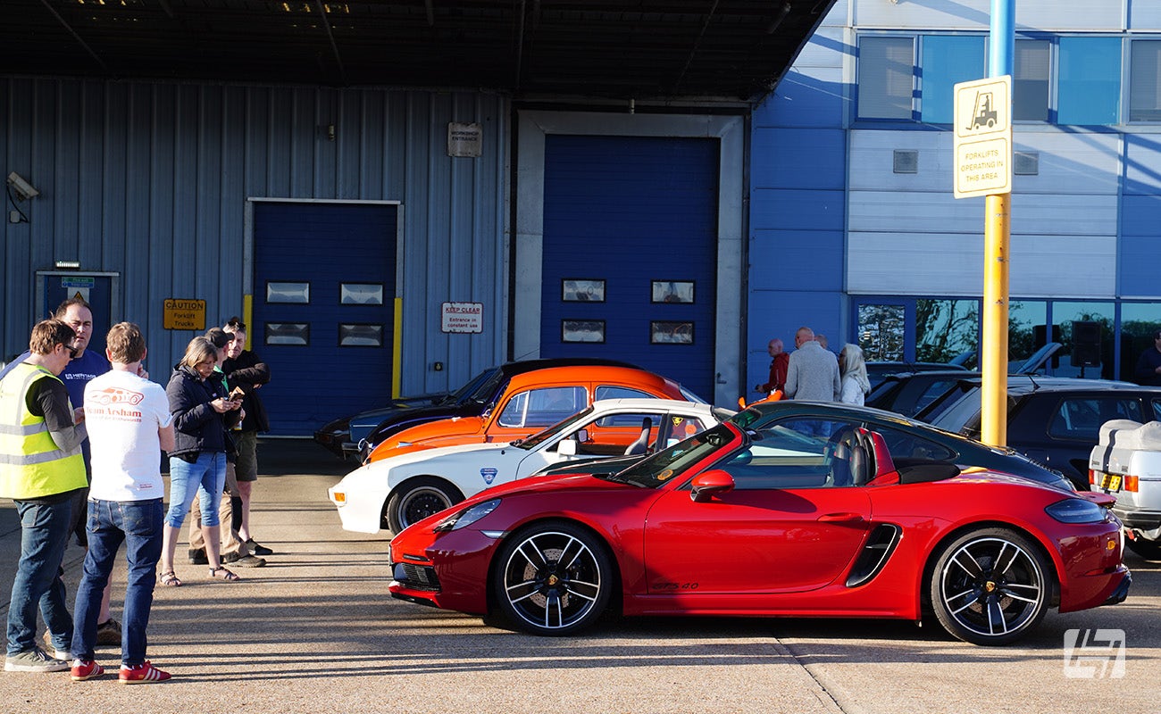Porsche and People Chatting at Heretics April 2025 Meeting at Heritage Parts Centre
