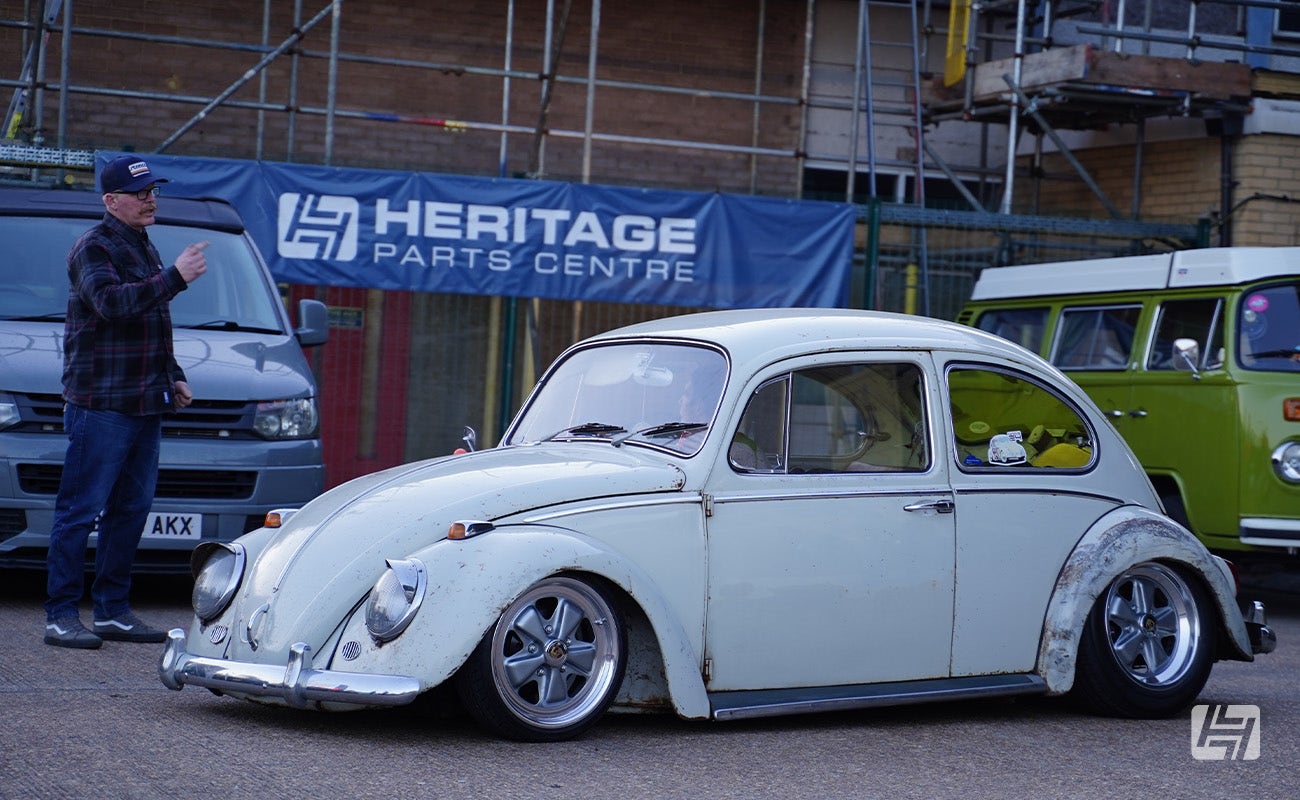 White VW Beetle on Fuchs alloy wheels at Heretics April 2025 Meeting at Heritage Parts Centre