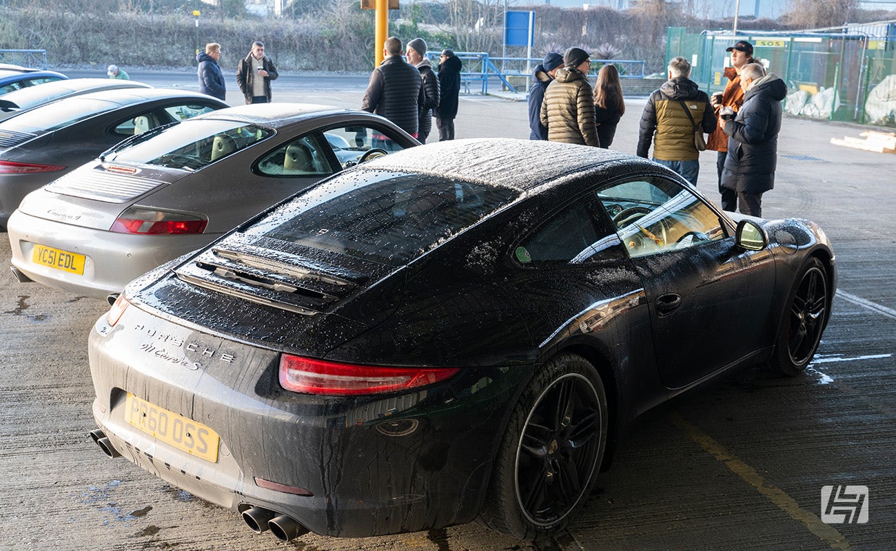 Black Porsche 991 with ice on the roof at Heritage Parts Centre 9Werks warehouse meet