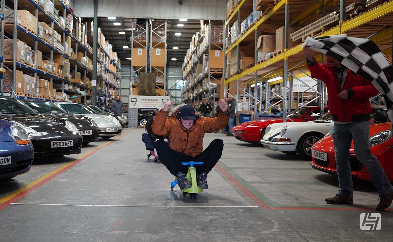Each wiggle car race was finished with a chequered flag at Heritage Parts Centre 9Werks warehouse meet