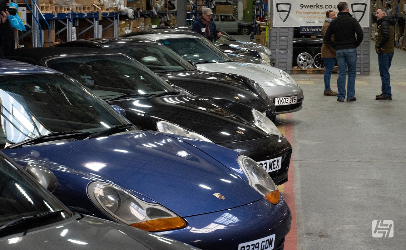 Collection of Porsches parked at Heritage Parts Centre 9Werks warehouse meet