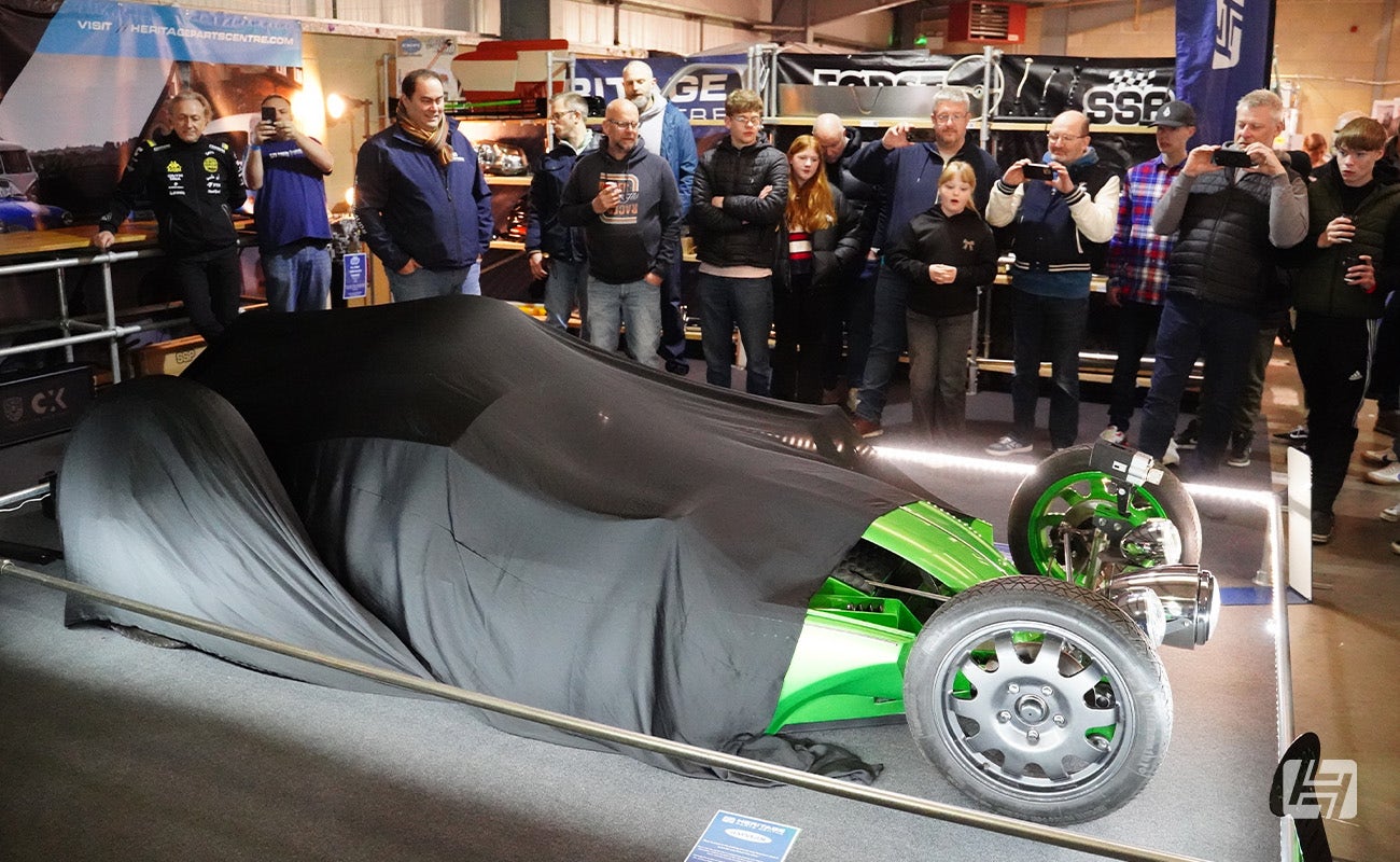 The big reveal of The Riddler car on the Heritage Parts Centre stand at Volksworld 2025